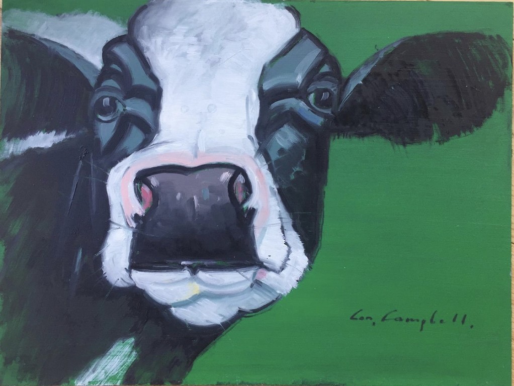 Cow on green